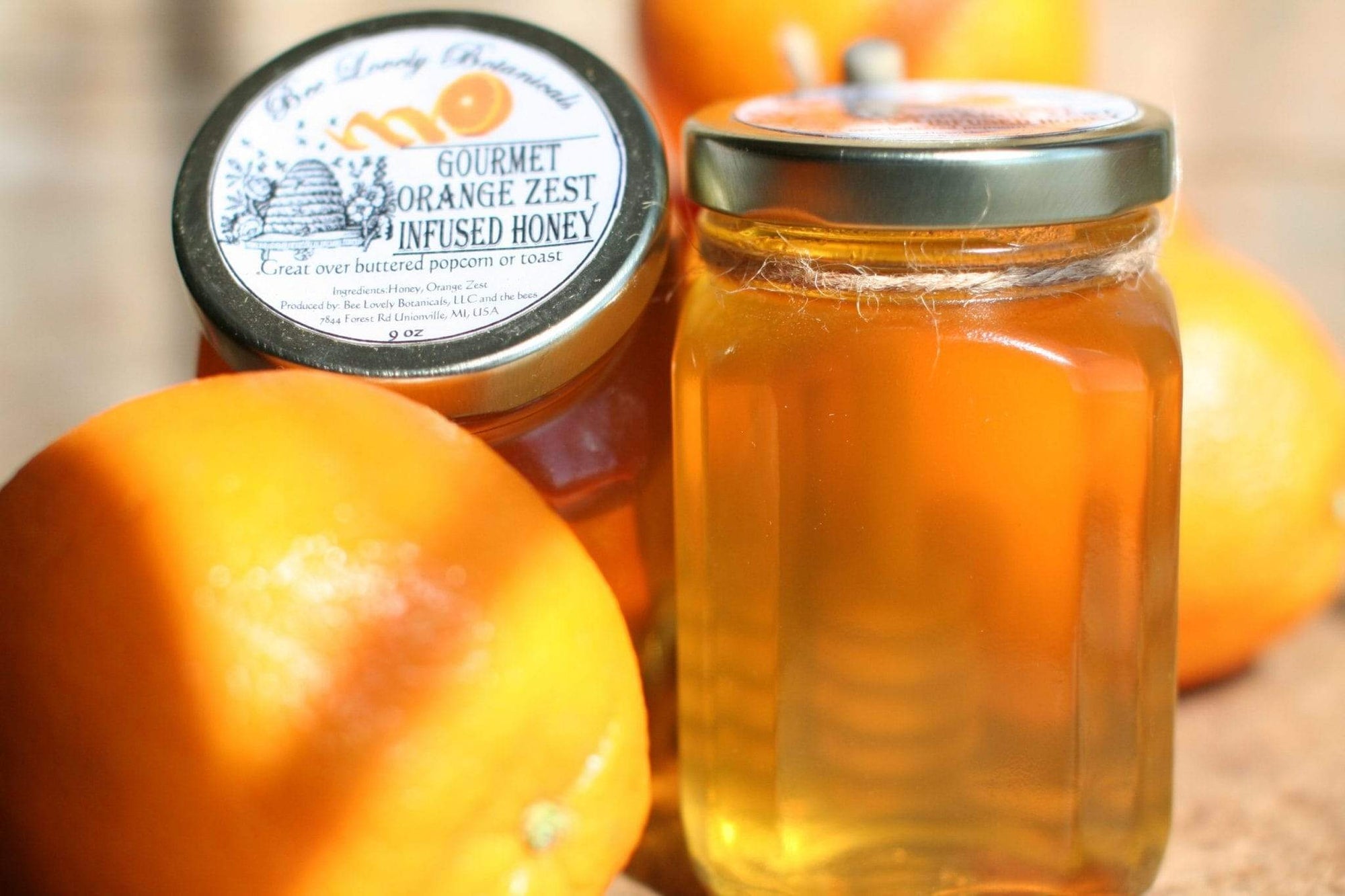 Orange Zest Infused Honey in Glass Jar with Honey Dipper by Bee